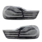 Vekto LED tail lights for BMW F32/F33/F36 4 Series 2013-2020, showing sleek red and clear lens design on a vehicle.