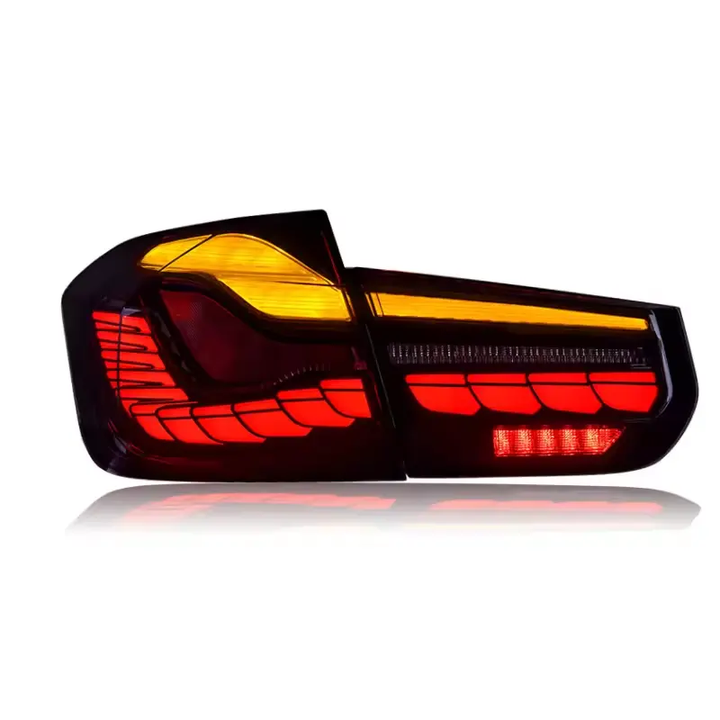 Vekto GTS Style LED tail lights for BMW F30, F35, and F80 showing sleek red and clear lens design on a modern vehicle