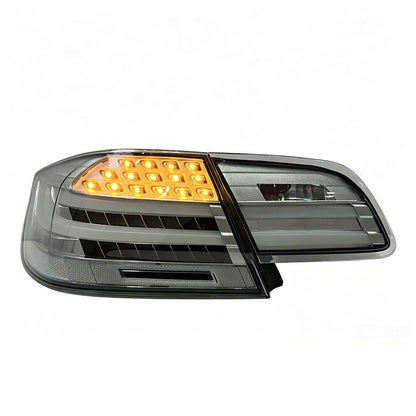 Clear LED taillights for BMW 3 Series E92 coupe, 2006-2012, by Vekto, showing sleek, modern tail light design with bright LED elements.
