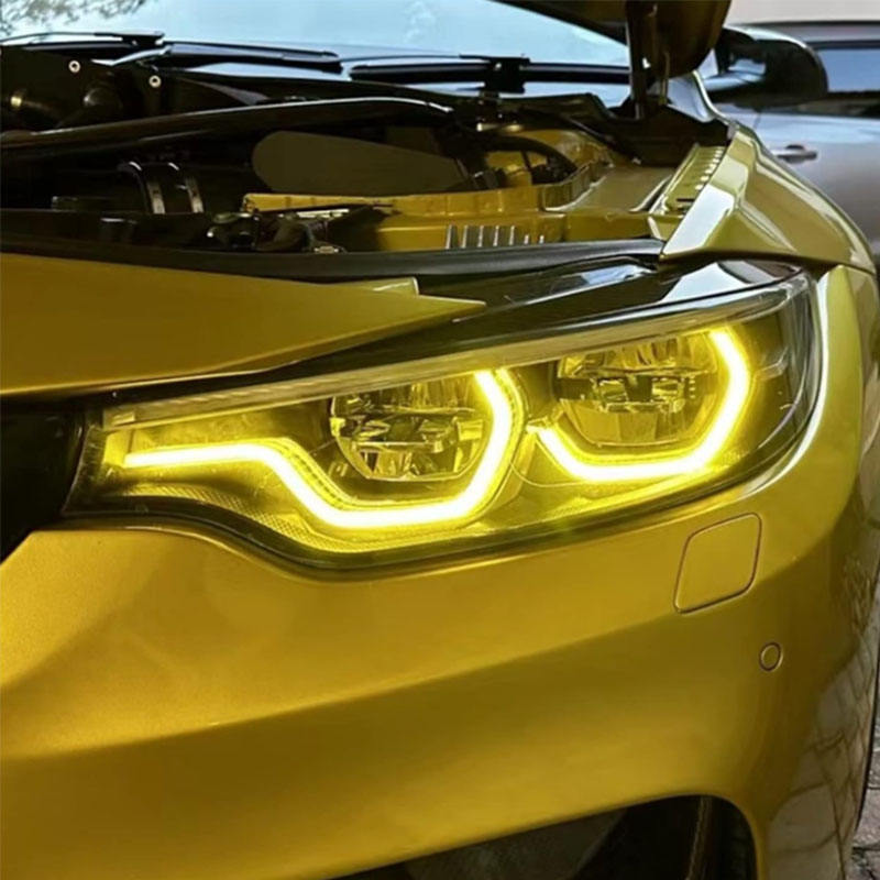 Vekto RGB LED DRL module kit installed in BMW F80 M3 and F82 M4 headlights, showcasing customizable daytime running lights.