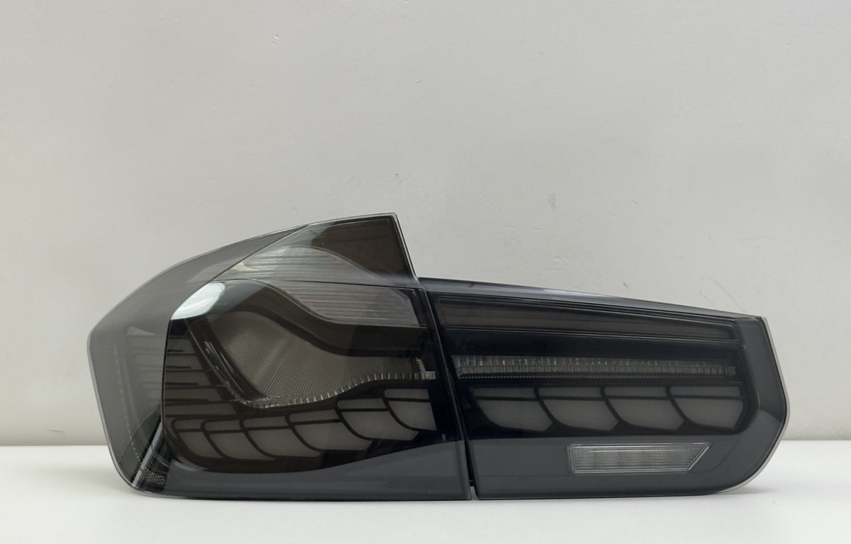 Vekto GTS Dragon Scale LED tail lights for BMW F30, F35, F80 2012-2019, showcasing sleek dragon scale design on vehicle tail section.