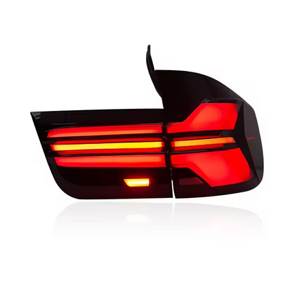 Vekto LED tail light assembly for BMW X5 E70 2007-2013 rear lamp with red and clear lens, showing illuminated taillights.