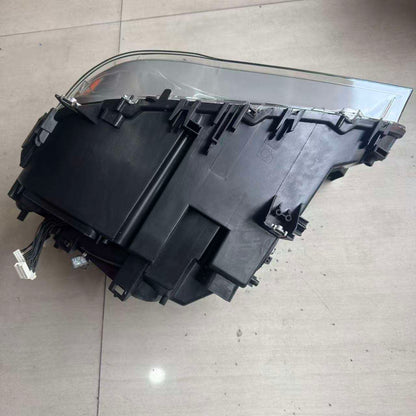 Vekto OEM Xenon HID headlight assembly for BMW 7 Series F01/F02 2009-2013 with AFS, showing the headlight unit with clear lens