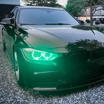 Vekto RGB LED DRL modules installed in BMW F30/F31/F35 Pre-LCI xenon headlights, showcasing vibrant multi-color LED daytime running lights.