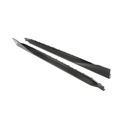 Carbon fiber side skirt extensions for BMW G82 and G83 M4 by K2 Industries, showcasing sleek, aerodynamic design on a sports car.