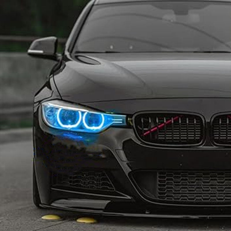 Vekto RGB LED DRL modules installed in BMW F30/F31/F35 pre-LCI xenon headlights, showcasing vibrant lighting for 2012-2015 models.