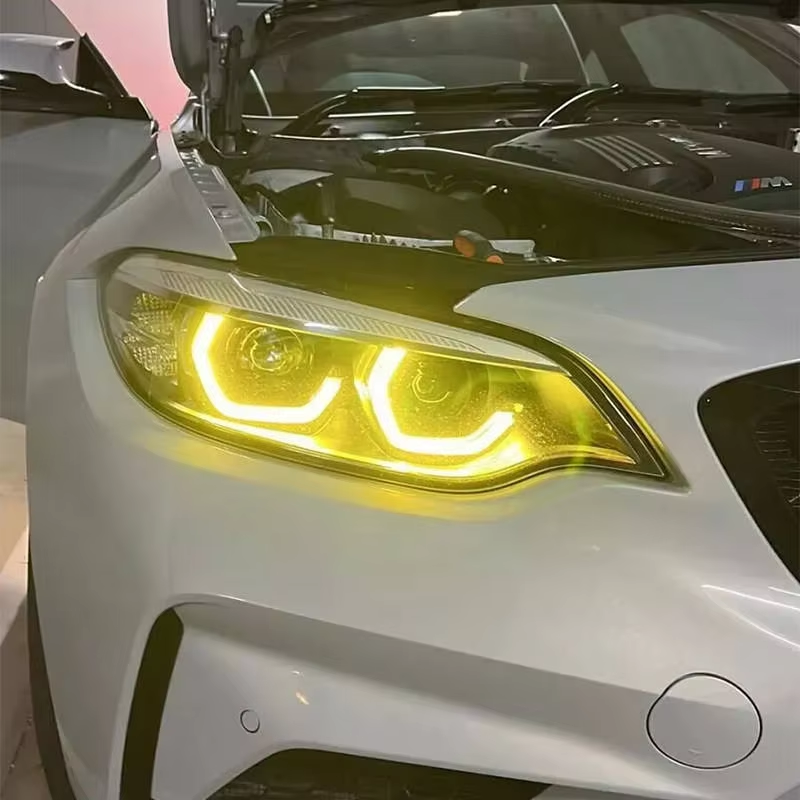 Vekto dual-color LED daytime running light modules for BMW F22/F23 2 Series LCI headlights, 2018-2020, showing installed LED strips