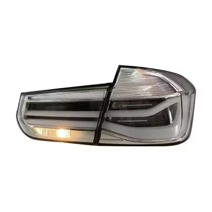 Vekto MP Style clear LED tail lights for BMW 3 Series F30/F35 2012-2018, showing sleek, modern taillight design on vehicle
