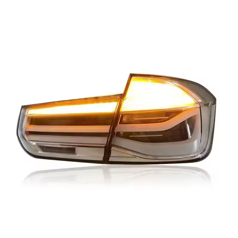 Vekto clear LED taillights for BMW 3 Series F30/F35 2012-2018, showing sleek design and bright illumination on the vehicle.