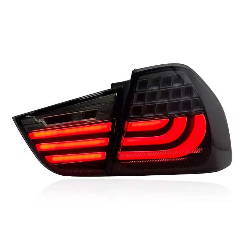 Vekto LED tail lights for BMW 3 Series E90 LCI 2009-2012, showing illuminated red and clear taillight lenses on a vehicle.
