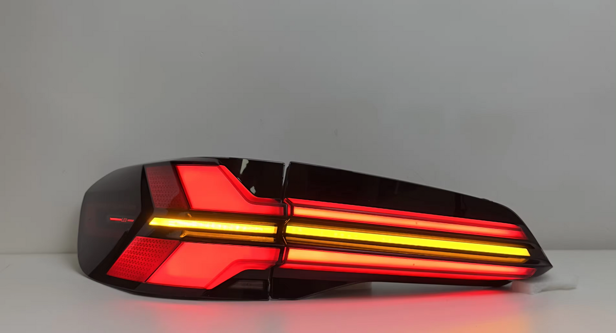 Vekto LED taillights for BMW X5 G05 2019-2023, showing sleek tail light design with illuminated red sections on vehicle rear.
