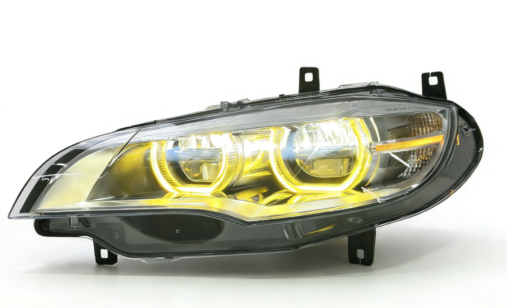 Vekto dual-color angel eye LED headlights for BMW X6 E71 2008-2014, close-up of illuminated headlights with angel eye rings.