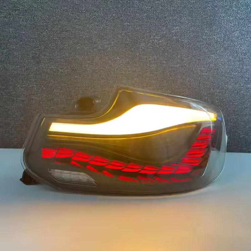 Vekto GTS Dragon Scale LED taillights for BMW 2 Series F22 2014-2021 showing sleek, dragon scale design illuminated at night