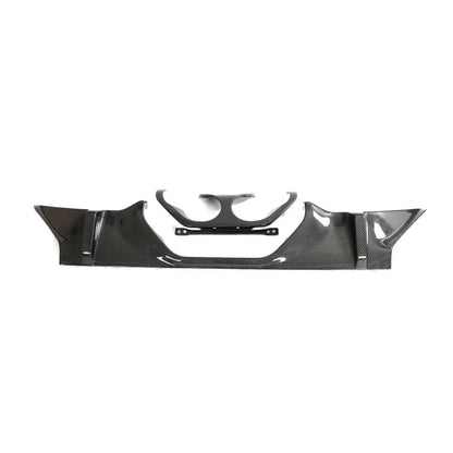 Carbon fiber rear diffuser for BMW M2 G87 coupe by K2 Industries, showing sleek aerodynamic design and textured carbon fiber surface.