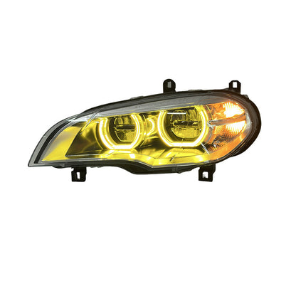 Vekto dual-color LED headlights for BMW X5 E70 showcasing sleek design and bright illumination in a close-up view.