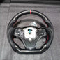 Hydro-Dip carbon steering wheel for BMW E90/E92/E93 M3, Vekto brand, showing detailed black carbon finish on the steering wheel.