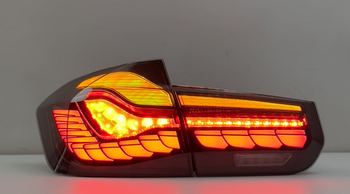 Vekto GTS Dragon Scale LED tail lights installed on BMW F30/F35/F80 2012-2019, showcasing sleek taillight design.