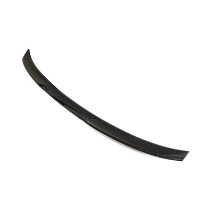 Dry carbon fiber M Style trunk spoiler for BMW G82/G83 M4 and G22 430i, made by K2 Industries, shown on the vehicle's rear.