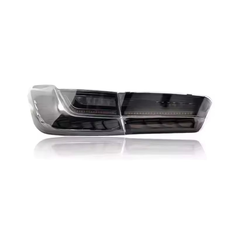 Vekto GTS OLED tail lights for BMW G20 3 Series and G80 M3 in cherry red and smoked finish, showing illuminated LED design.