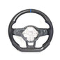 Vekto carbon fiber steering wheel for VW Golf 7 GTI R Mk7, close-up of sleek black and textured carbon fiber surface.