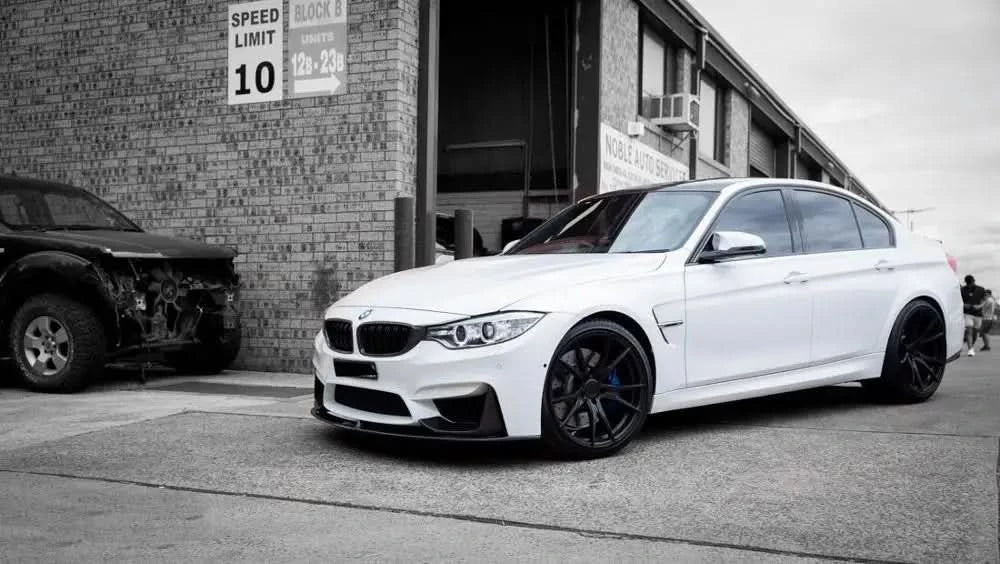 Performance Dry Carbon Front Lip Splitter set for BMW F80 M3 and F82 M4, showcasing sleek carbon fiber design by K2 Industries.