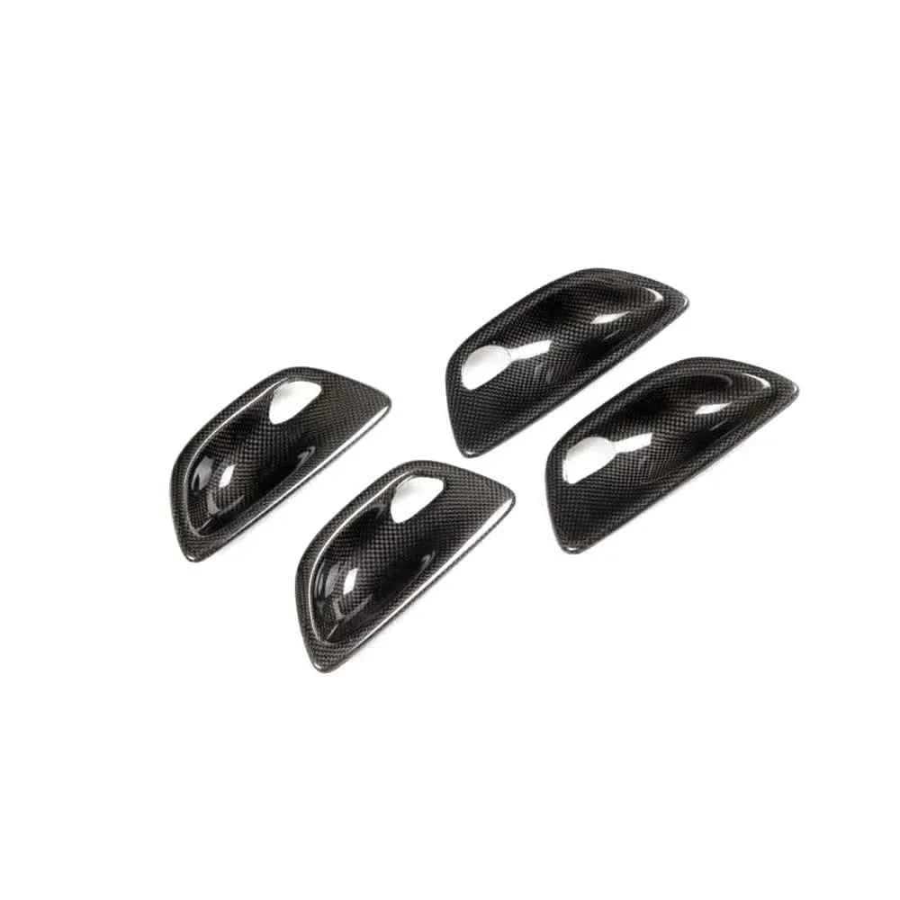 Carbon fiber interior door handle trim set for BMW F10 5 Series by K2 Industries, performance style door handle covers.