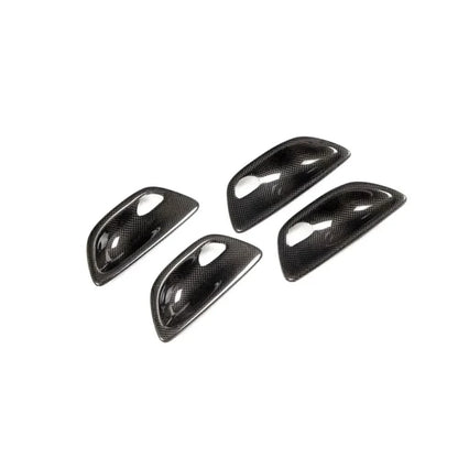 Carbon fiber interior door handle trim set for BMW F10 5 Series by K2 Industries, performance style door handle covers.