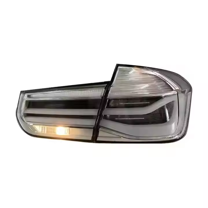 Clear LED tail lights for BMW 3 Series F30/F35 2012-2018 by Vekto, showing sleek, modern taillight design with LED illumination.