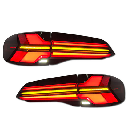 Clear LED tail lights for BMW X5 G05 2019-2023, Vekto brand, showing sleek design and bright illumination in a close-up view.