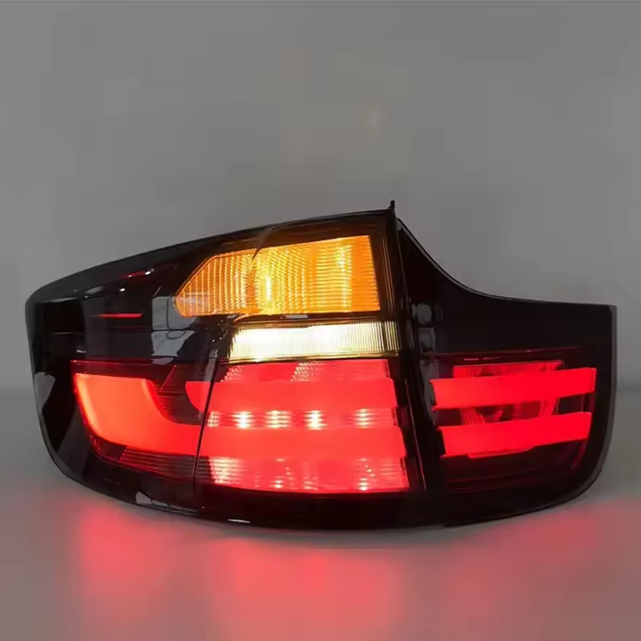 Vekto LED taillights for BMW X6 E71 2007-2014, showing sleek red and clear lens tail light assembly with wiring connectors.