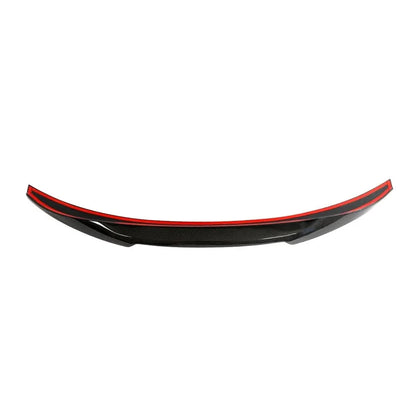 Dry carbon fiber M4-style rear trunk spoiler on a BMW F30/F35 3 Series or F80 M3, showcasing sleek aerodynamic design.