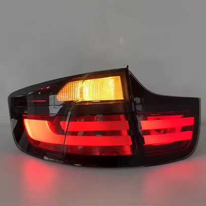 Vekto LED taillights for BMW X6 E71 2007-2014, showing sleek red and clear tail light design on a vehicle.
