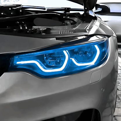 Vekto RGB LED DRL module kit installed in BMW F80 M3 and F82/F83 M4 LCI headlights, showcasing vibrant LED daytime running lights.
