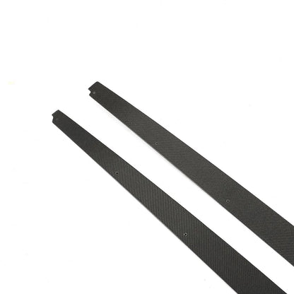 Carbon fiber side skirts for BMW F10 M5 and M Sport, K2 Industries performance side extensions on the vehicle's side.