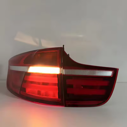 Vekto LED taillights for BMW X6 E71 2007-2014, showing sleek tail light assembly with illuminated LEDs on a vehicle.