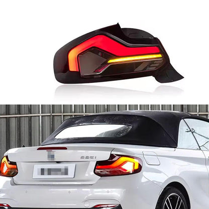 Vekto BMW 2 Series F22/F23 and M2 F87 CSL RGB Laser Style LED tail lights, with sleek red and LED accents installed on a 2014-2022 BMW.