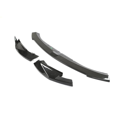 Carbon fiber front lip for BMW G80 M3 and G82 G83 M4 by K2 Industries, enhancing sporty front end styling.