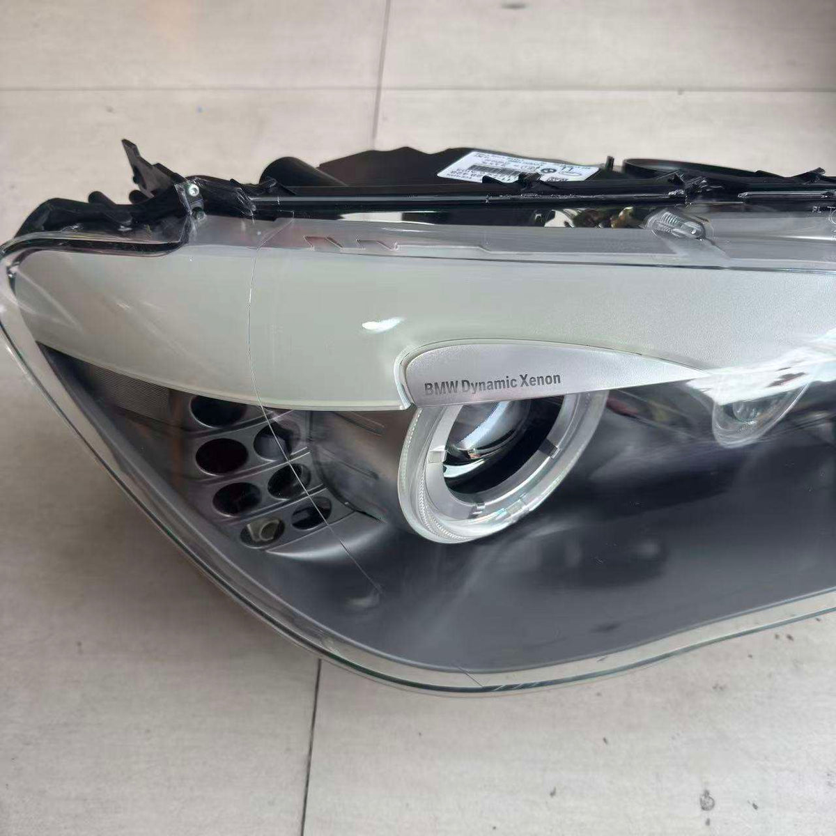 Vekto OEM Xenon HID headlight assembly for BMW 7 Series F01/F02 2009-2013 with AFS, showing the front view of the headlight unit.
