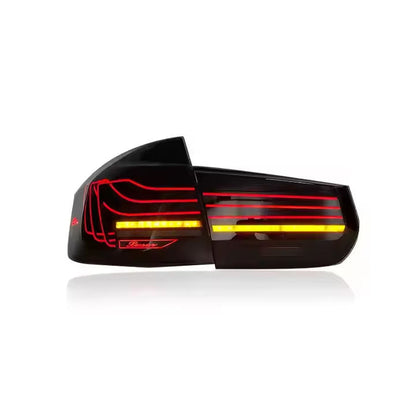 Vekto CSL style LED tail lights for BMW 3 Series F30/F35 and F80 M3, showcasing sleek red and clear lens design on a BMW.