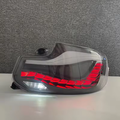 Vekto GTS Dragon Scale LED taillights on a BMW 2 Series F22, rear view showing red and clear lens design for 2014-2021.