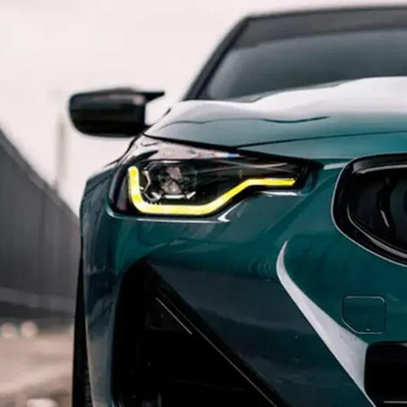 Vekto dual-color LED daytime running light modules for BMW G42 2 Series and G87 M2 headlights, showcasing sleek design and illumination.