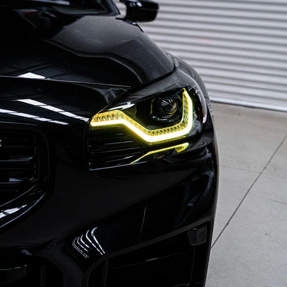 Vekto dual-color LED daytime running light modules for BMW G42 2 Series and G87 M2 headlights, showing illuminated LED strips.