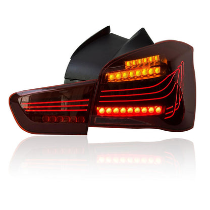 Vekto CSL style LED tail lights installed on a BMW 1 Series F20/F21, showing sleek red and clear lens design.