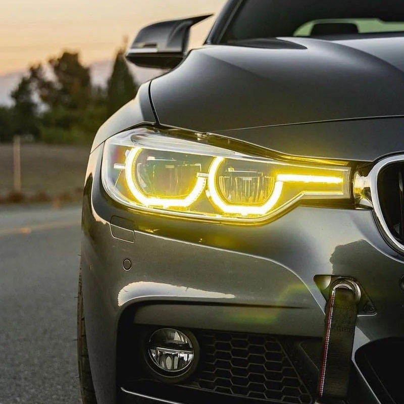 Vekto dual-color LED daytime running light modules for BMW F30/F31/F35 3 Series headlights 2016-2019, showing installed LED units