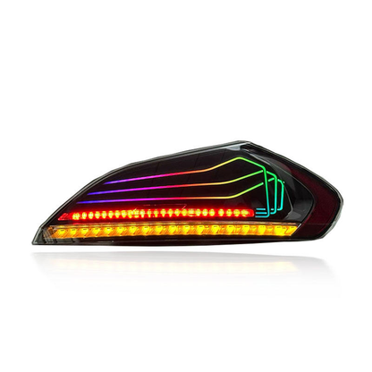 Vekto RGB CSL style LED tail lights installed on a BMW Z4 E89 2008-2016, showing vibrant red and white illumination.