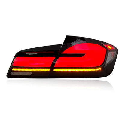 BMW 5 Series F10 F18 LED tail lights with sequential turn signals by Vekto, showcasing sleek red and clear lens design