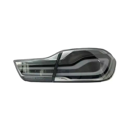 Clear LED BMW 4 Series tail lights by Vekto, showing sleek, modern design with bright LED illumination for F32, F82, and F83 models.
