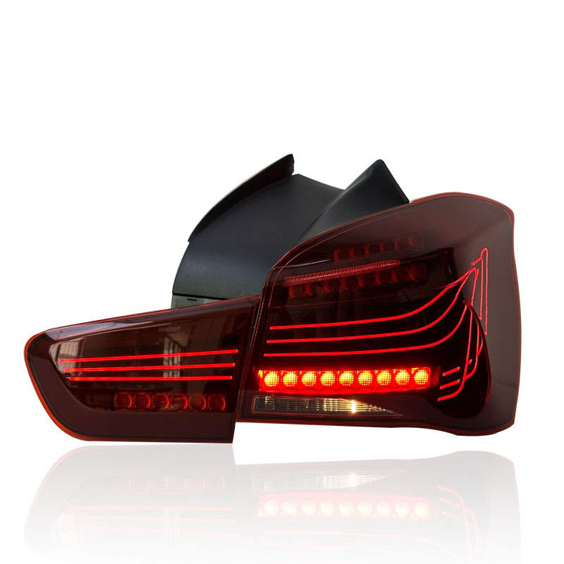 Vekto CSL style LED tail lights for BMW 1 Series F20/F21 LCI hatchback 2015-2018, showing illuminated red and clear lenses
