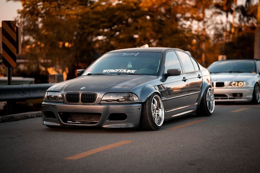 K2 Industries BMW 3-Series E46 Sedan full over fender kit with vented front fenders, made of ABS or fiberglass, shown on vehicle.