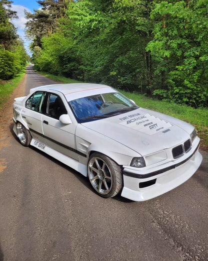 BMW E36 Vented Front Over-Fenders by K2 Industries, showcasing black over-fenders with vented design for 1990-1999 models.